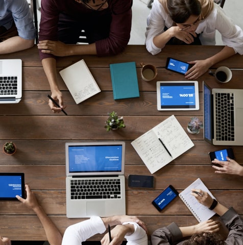 People around a table, working together